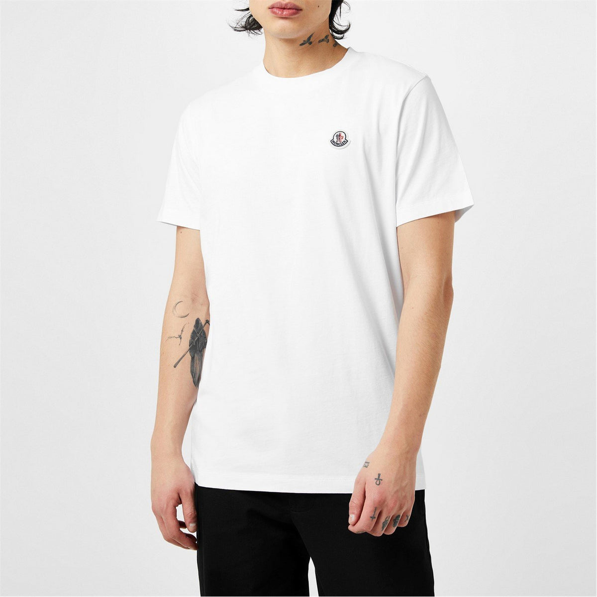 White cotton T-shirt with small chest logo badge and short sleeves