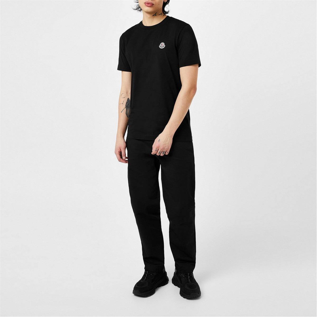 Black cotton T-shirt with small chest logo badge and crew neck