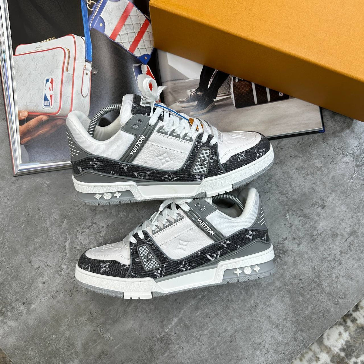 Black and white LV monogram lace-up trainers with chunky sole and logo accent straps