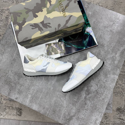 White Rockrunner sneakers with blue accents, lace-up low tops