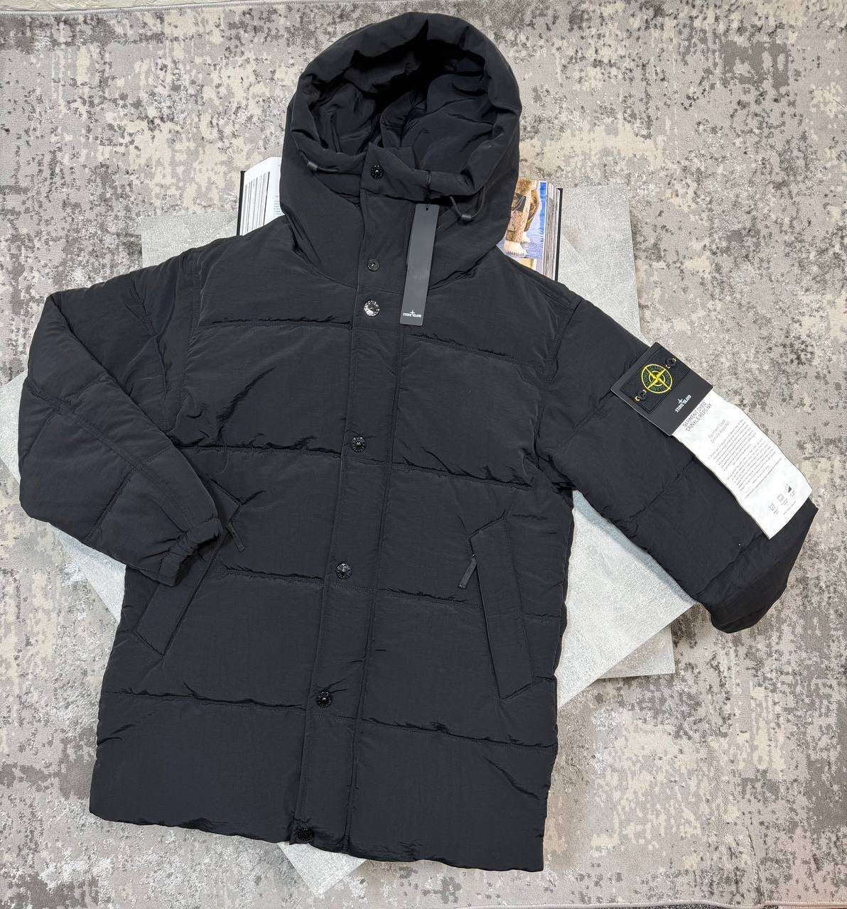Black puffer coat with attached hood, button front, long sleeves
