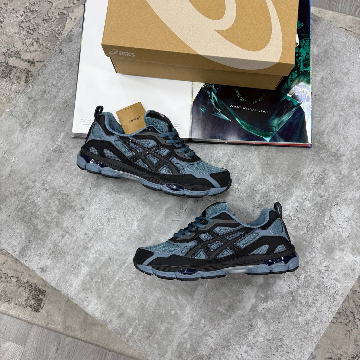 ASICS running shoes in dark blue-gray with navy laces and blue accent outsole