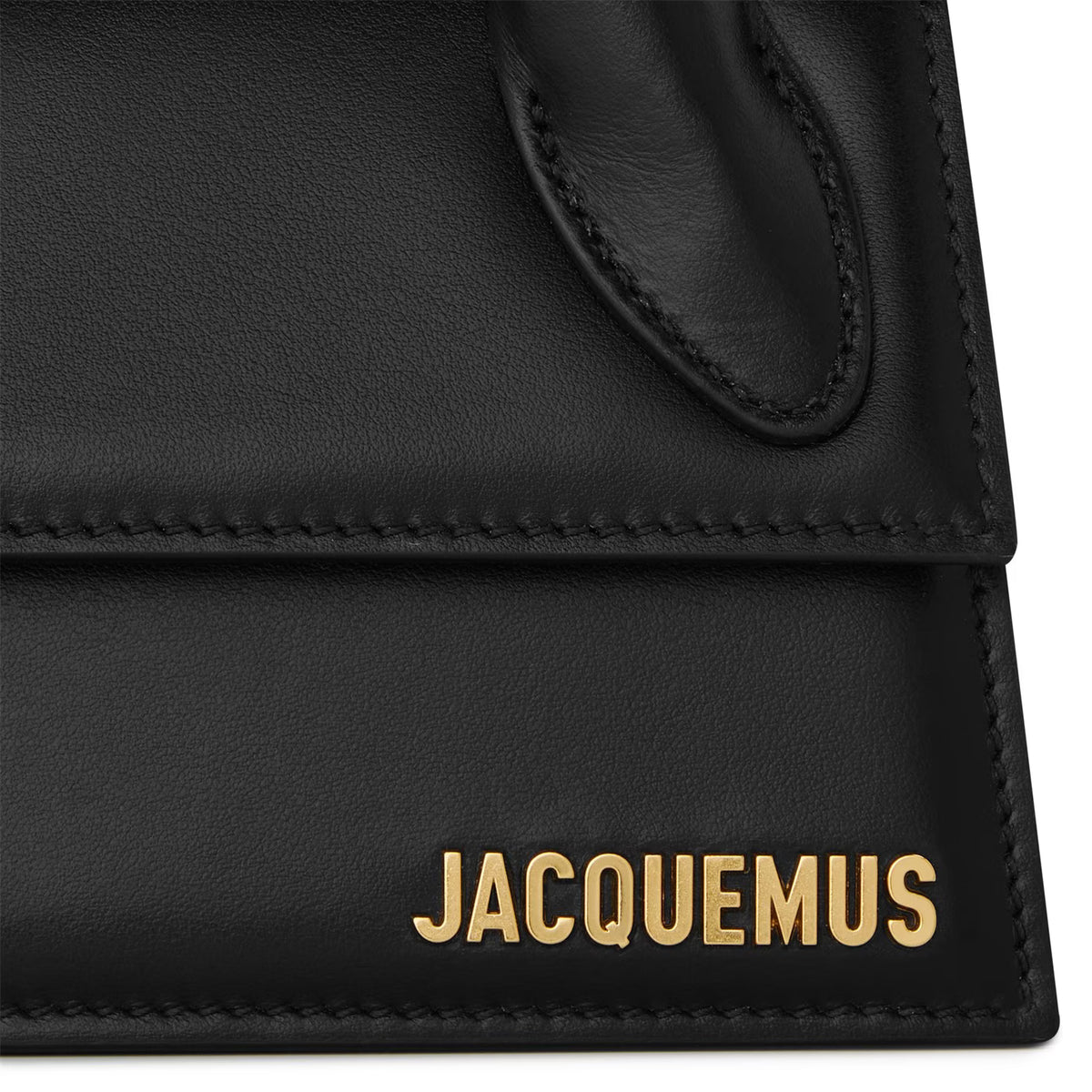 Black leather mini bag close-up with gold JACQUEMUS logo and stitched trim