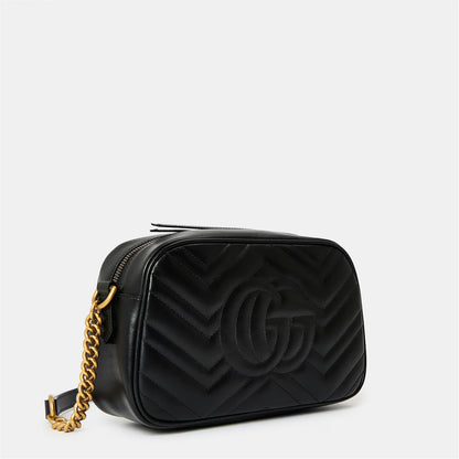 Black leather small shoulder bag with embossed chevron pattern, gold-tone GG, chain strap.