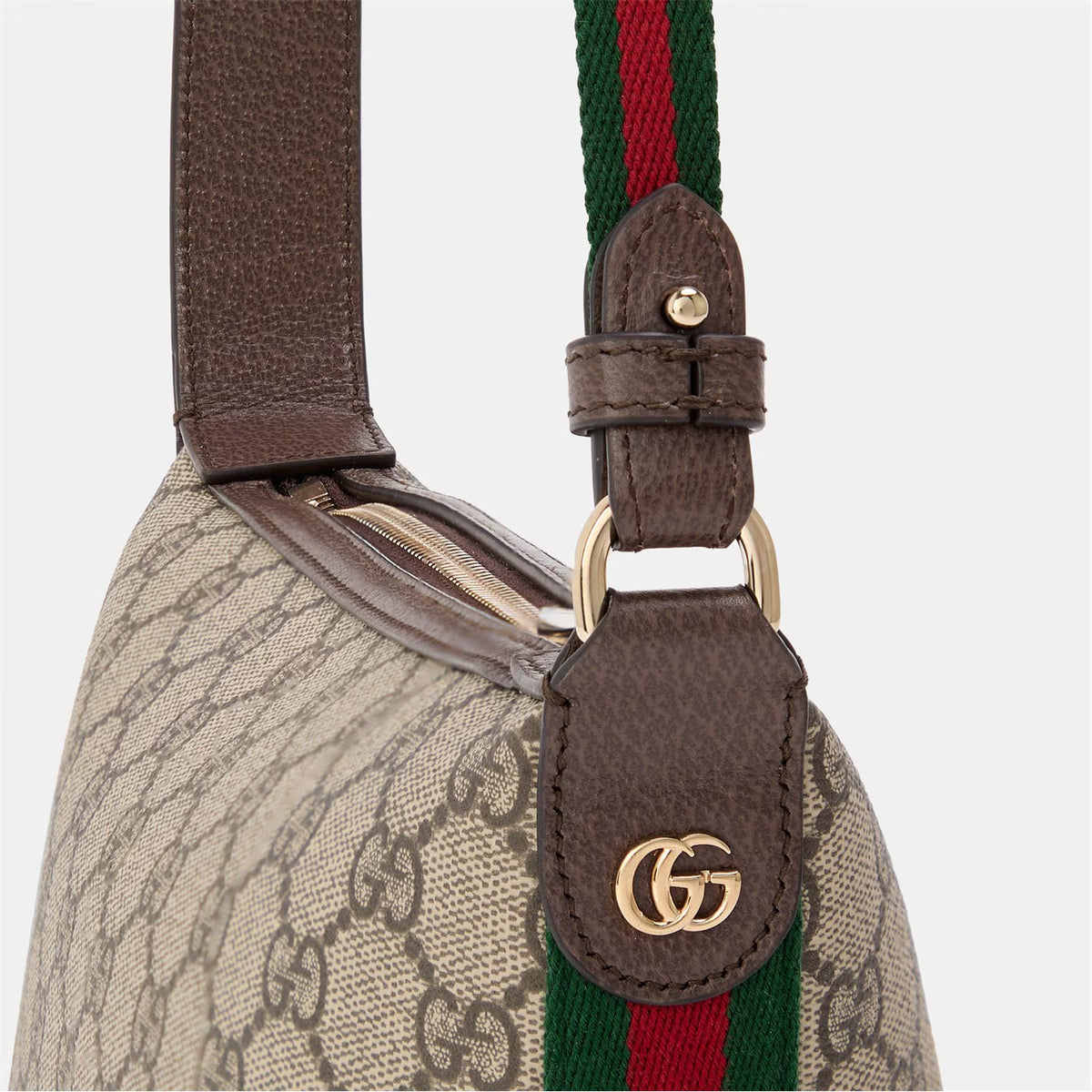 Close-up of brown leather strap and GG-pattern body with green/red web detail