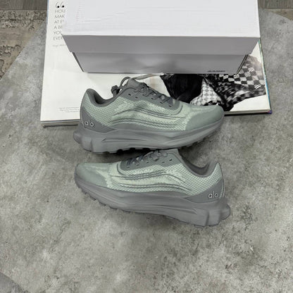 Green lace-up training sneakers with textured upper and thick rubber tread sole