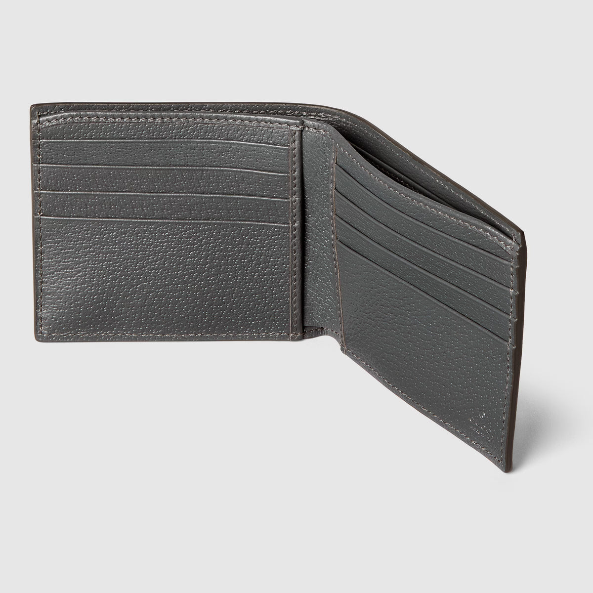 Open grey bi-fold wallet interior: left card slots, right fold pocket