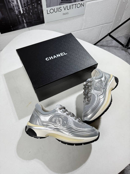 Silver chunky trainers with lace-up design and black outsole tread detail