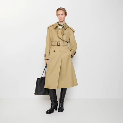 Long trench coat in sand beige with buckled belt and plaid lining at the placket
