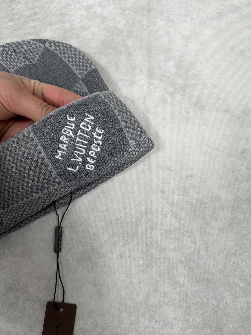 LV gray checkerboard knit beanie with embroidered cuff patch and hang tag