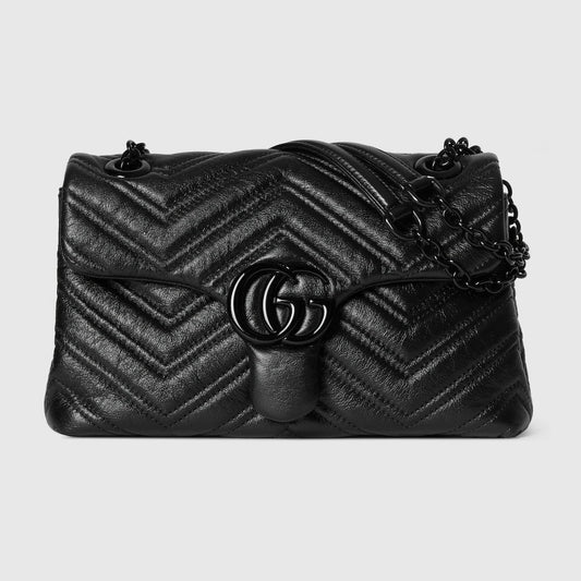 GG Marmont small shoulder bag in black quilted leather with double G clasp