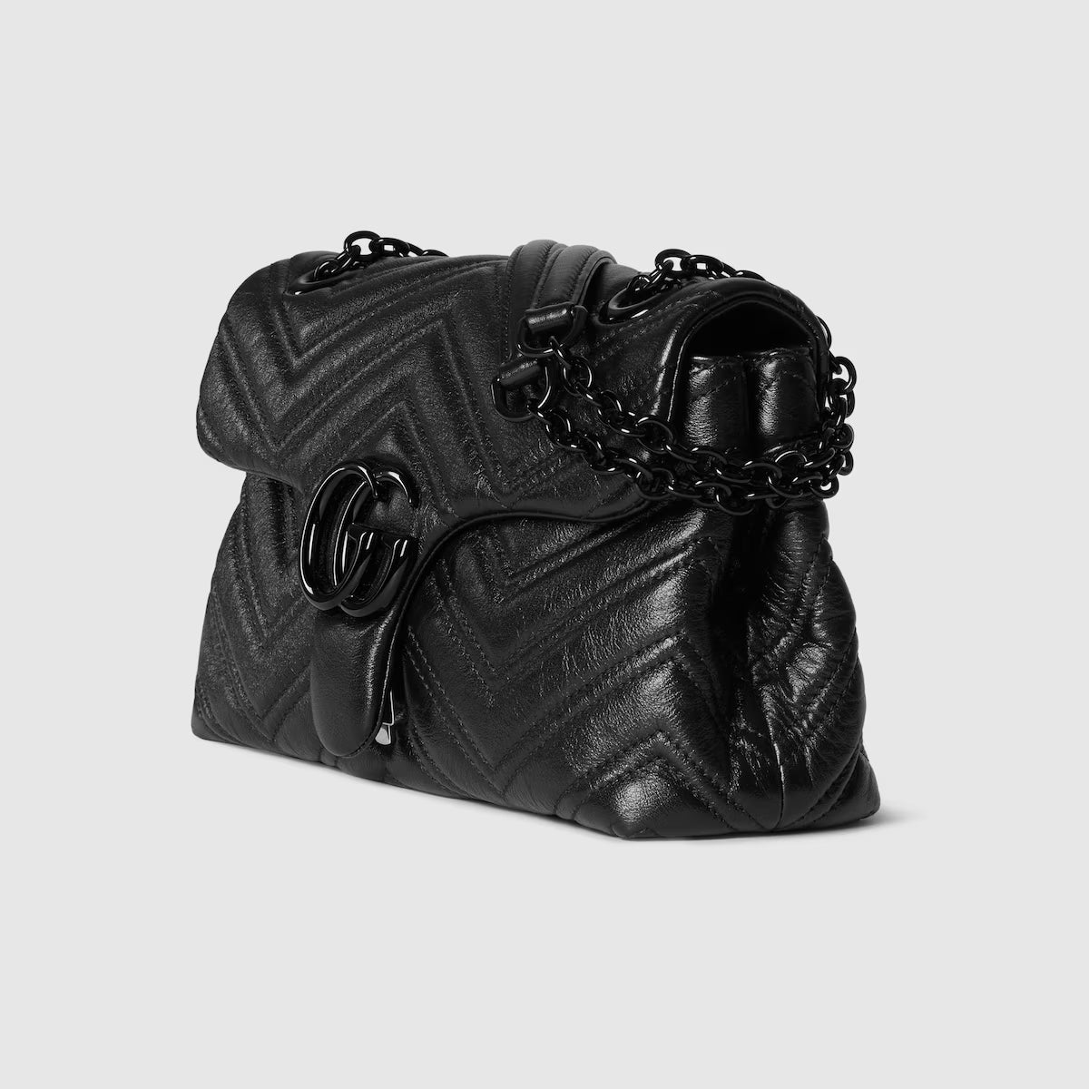 Black GG Marmont small shoulder bag, side view with chain strap and quilted pattern