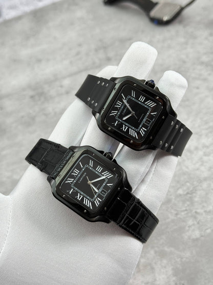 Cartier Santos watch pair with black dial and black straps, one leather one rubber