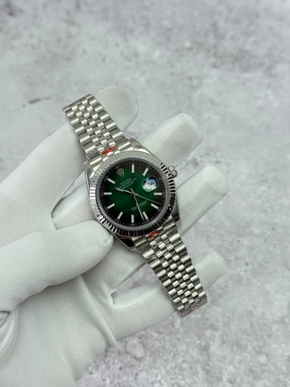 Rolex Datejust stainless-steel watch with green dial and bracelet, fluted bezel