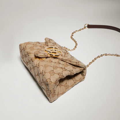 Beige GG Marmont mini shoulder bag underside with monogram canvas and gold hardware detail