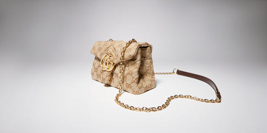 GG Marmont mini shoulder bag in beige monogram canvas with gold clasp and chain strap