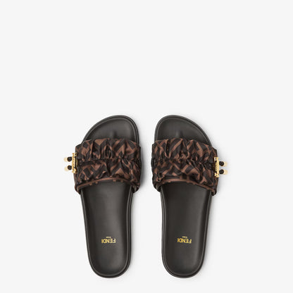 Pair of brown slide sandals with FF-pattern ruffle bow and gold details