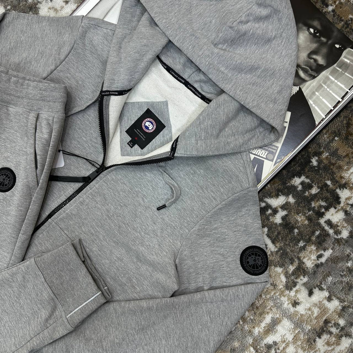 Grey tracksuit set with zip-up hooded jacket and drawstring pants, close fit cuffs