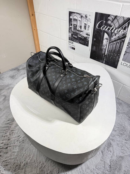 LV monogram carry bag with two short handles and long shoulder strap, zip top