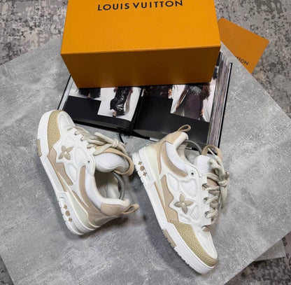 Cream skate sneakers with beige laces and logo flower emblems, chunky white sole
