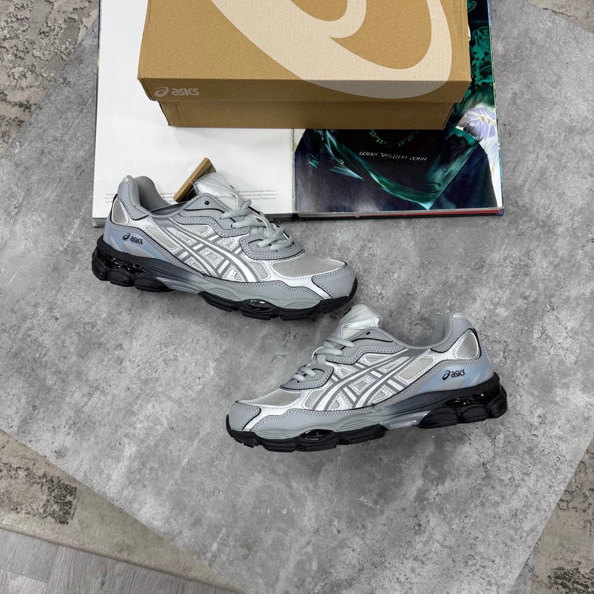 ASICS running shoes in light gray with white mesh upper and black heel detail
