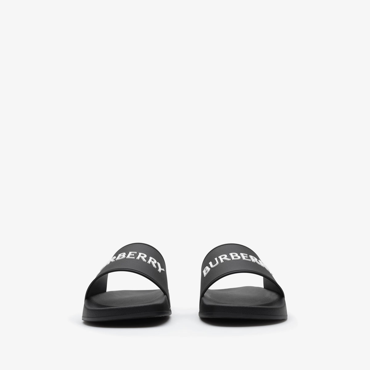 Schwarze Slides mit BURBERRY-Schriftzug auf dem Riemen