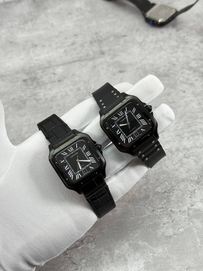 Cartier Santos watch pair with black dial; leather strap watch and rubber strap watch