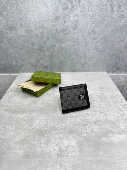 Black Gucci GG-pattern leather wallet, front view with snap button