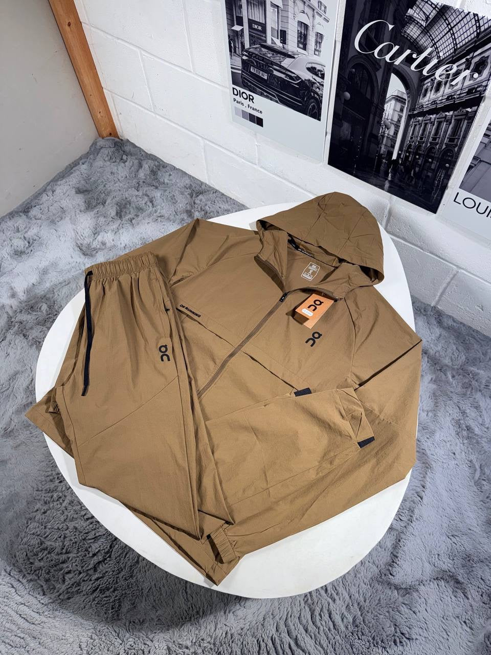 Hooded zip tracksuit jacket in brown with logo patch and orange tag