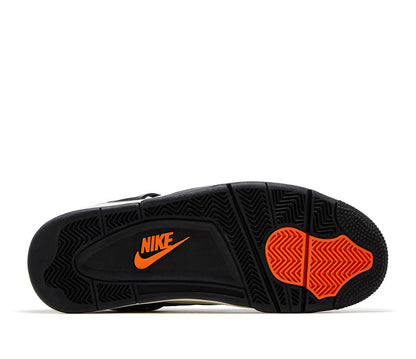 Retro basketball sneakers, black outsole with orange Nike logo and traction tread
