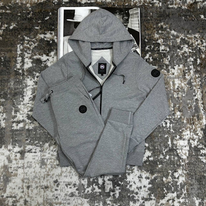Grey zip-up hooded tracksuit jacket with drawstring waist pants and side pockets