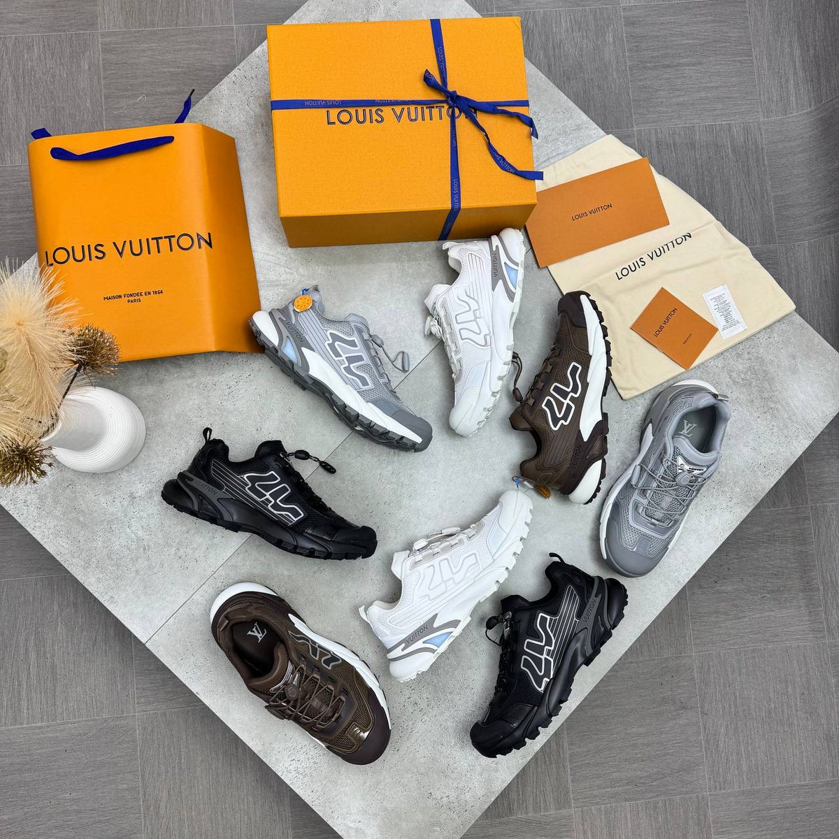 Multi-color 4LV trainer sneakers assortment with lace-up uppers and 4LV logos.