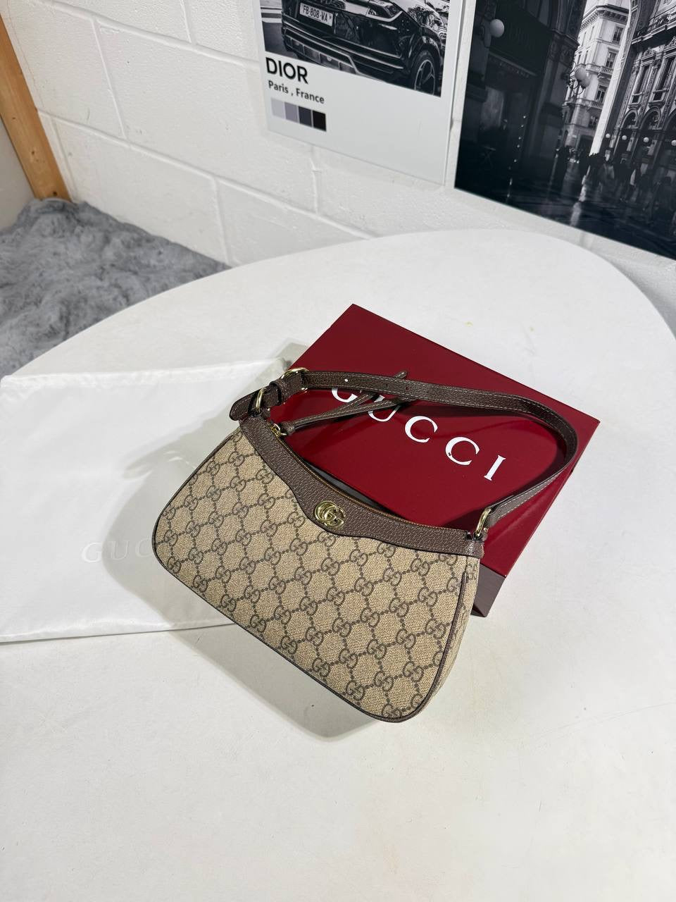 GG canvas mini handbag with red strap and gold-tone hardware, brown