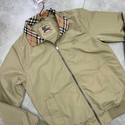 Beige Harrington jacket, front zip with welt pockets and Burberry check inner collar
