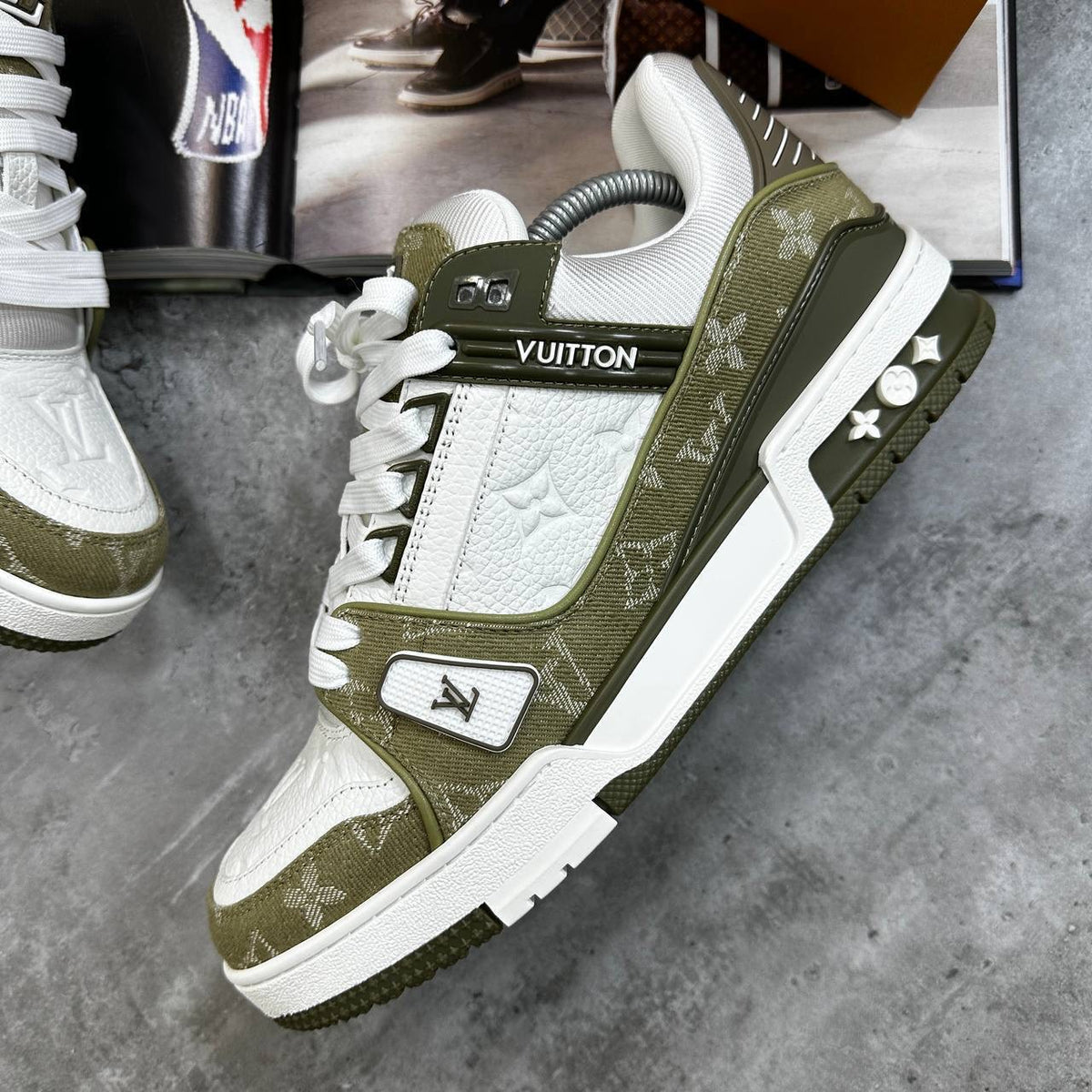Olive green and white LV lace-up sneaker with side emblem and textured front panel