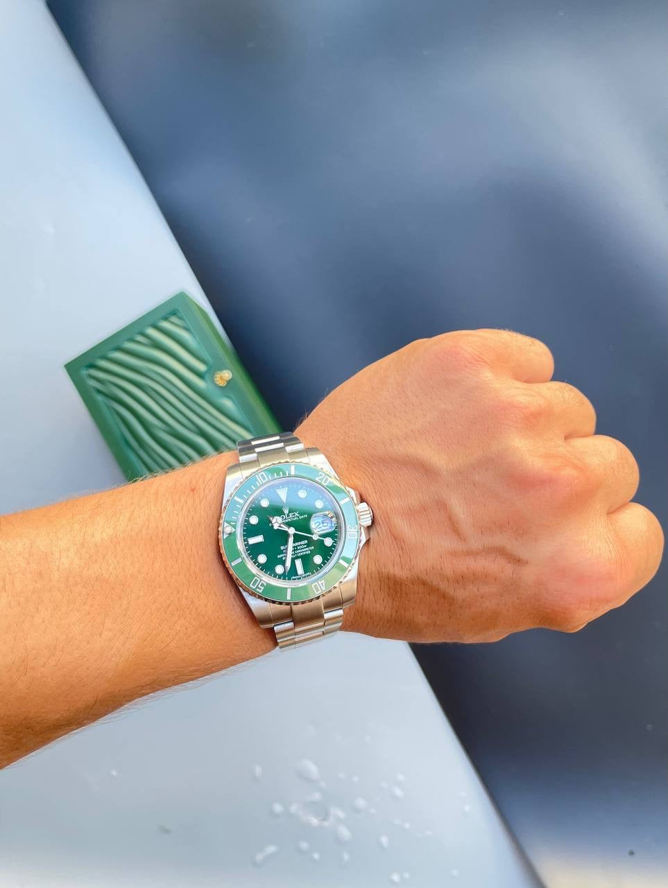 Rolex steel bracelet watch with green dial and luminous markers