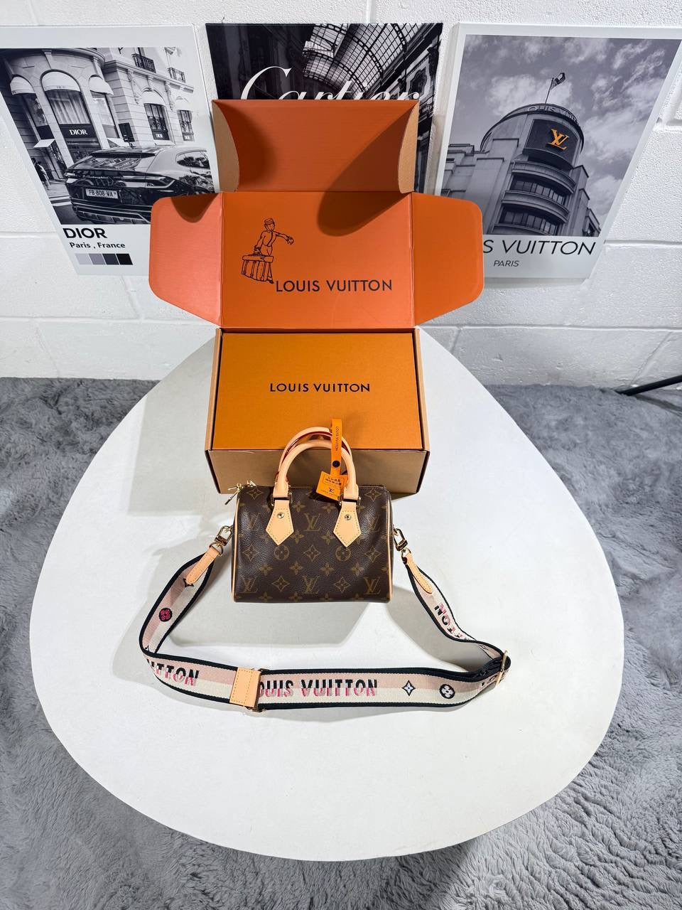 Louis Vuitton nano Speedy bag in monogram canvas with tan leather handles and logo crossbody strap