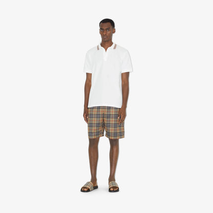 SupplierMode beige check slide sandals worn with plaid shorts