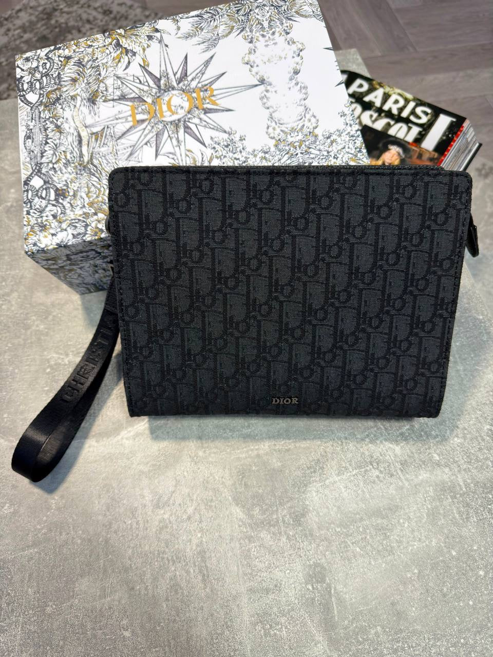 Black Oblique monogram pouch with top zipper and short wrist strap
