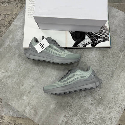 Grey lace-up training sneakers with textured upper and cushioned treaded sole