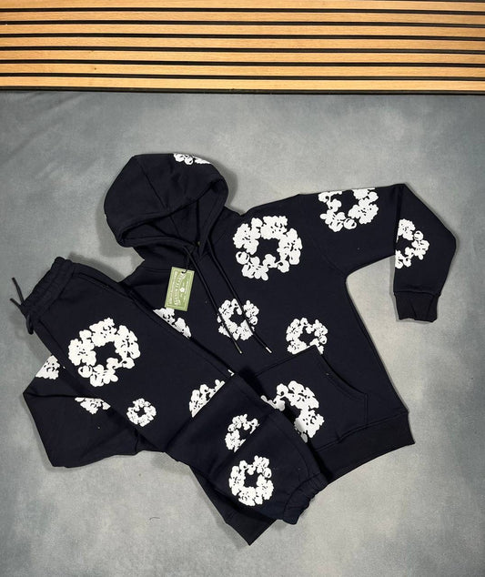Black hoodie and jogger tracksuit set with white floral logo pattern
