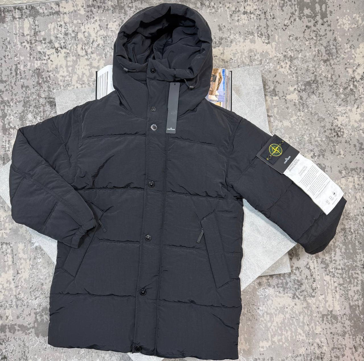 Black quilted puffer coat with hood, button closure, side pockets