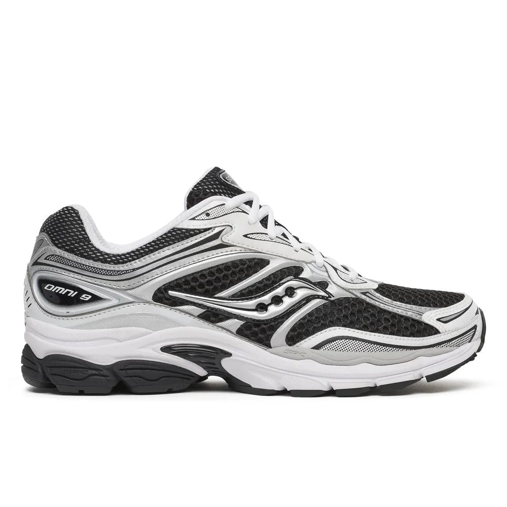 Saucony Omni 9s running shoes in white with black and silver overlays, lace-up