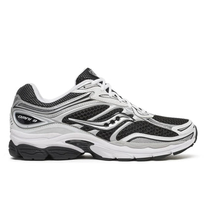 Saucony Omni 9s running shoes in white with black and silver overlays, lace-up