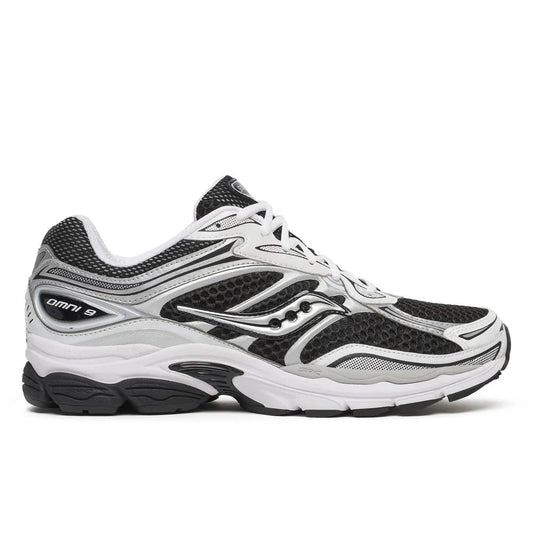 Saucony Omni 9s running shoes in white with black and silver overlays, lace-up