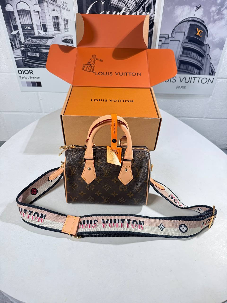 Louis Vuitton nano Speedy bag in monogram canvas with tan leather top handles, crossbody strap