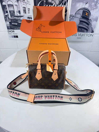 Louis Vuitton nano Speedy bag in monogram canvas with tan leather top handles, crossbody strap