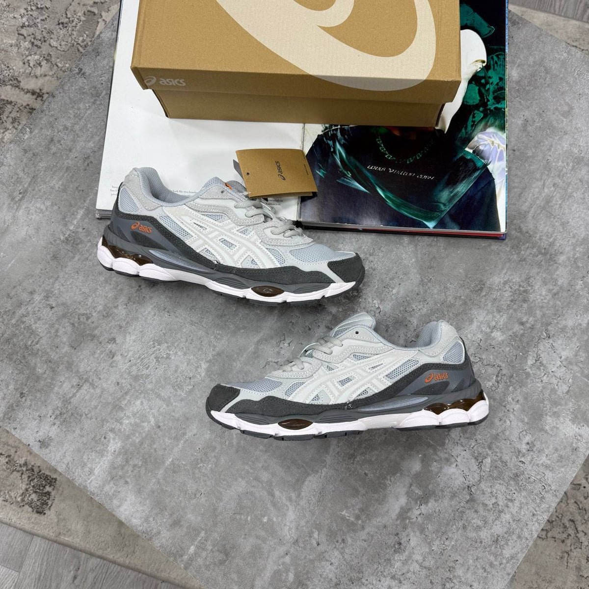 ASICS running shoes in light gray with white uppers and gray textured overlay panels