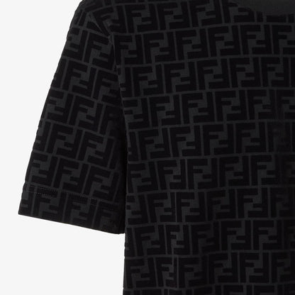 Black cotton T-shirt fabric close-up with repeating logo pattern and short sleeve