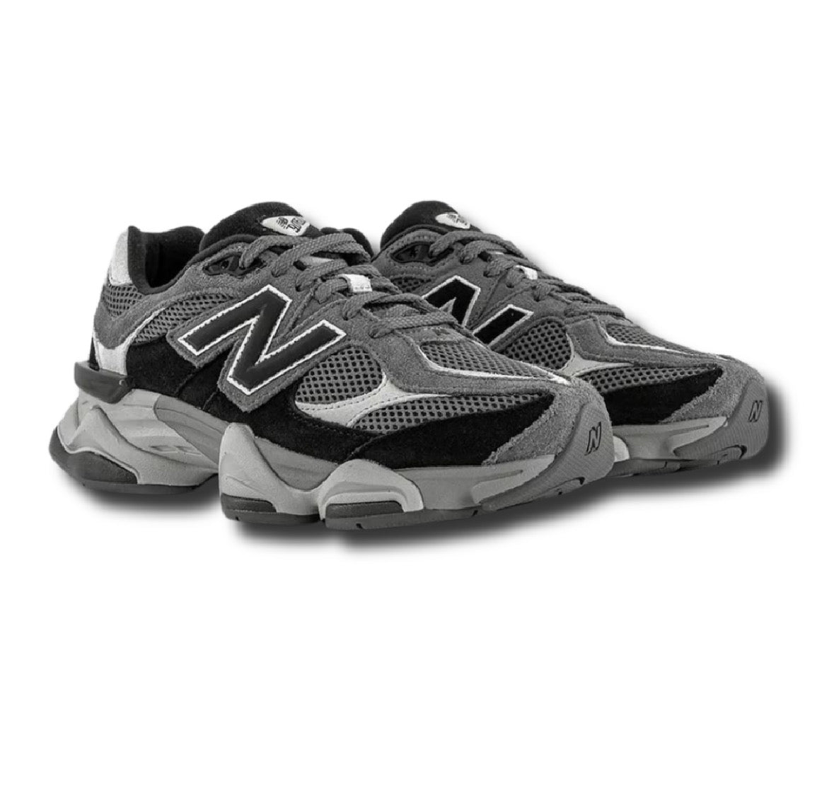 New Balance 9060s sneakers in grey and black with N logo, mesh panels, and chunky sole